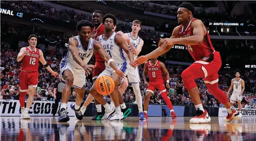  ?? GETTY IMAGES ?? According to Nielsen, 15.1 million people watched N.C. State beat Duke in the Elite Eight, the biggest audience for an Easter Sunday telecast since 2013.