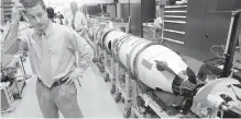  ?? AP ?? Christophe­r Del Mastro, head of anti-submarine warfare, with an unmanned underwater vehicle at a naval lab in Rhode Island.