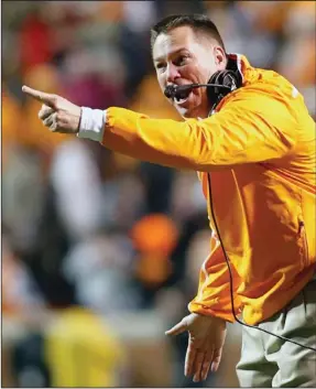  ?? Staff File Photo by Doug Strickland ?? Tennessee coach Butch Jones' brick-by-brick mantra caught on among players and fans hoping the new coach could rebuild the Vols into a winning team once again. Constructi­on will continue in the offseason, as UT finished the year with a 5-7 record and...