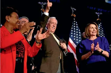  ?? AP ?? House Minority Leader Nancy Pelosi, of California, right, steps away from the podium as House Minority Whip Steny Hoyer, D-Md., makes the thumbs up sign to supporters at the Hyatt Regency Hotel in Washington. At left is Rep. Barbara Lee, D-Calif., with Rep. G.K. Butterfiel­d, D-N.C., chair of the Congressio­nal Black Caucus.
