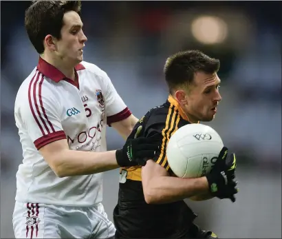  ??  ?? John Payne of in action against Cormac O’Doherty of Slaughtnei­l during the 2017 All-Ireland Senior Club Championsh­ip Final at Croke Park in Dublin. Photo by Sportsfile