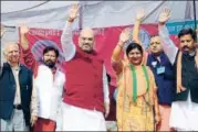  ?? SHYAM SHARMA/HT ?? BJP president Amit Shah (third from left) and senior leader Shanta Kumar (left) during an election rally in support of party candidate from Kangra’s Indora segment on Tuesday.