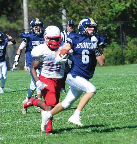  ?? Photos by Ernest A. Brown ?? After a couple of key drops earlier in the game, Burrillvil­le all-division senior receiver Aidan Tupper (6) delivered the game-winning touchdown when he reeled in a 60-yard touchdown pass in the unbeaten Broncos’ 21-14 Division II victory over Mt. Pleasant Saturday morning.