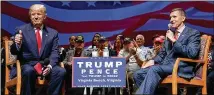  ?? EVAN VUCCI/ AP 2016 ?? Then- presidenti­al candidate Donald Trump gives a thumb’s up as he speaks with retired Lt. Gen. Michael Flynn during a town hall in September 2016 in Virginia Beach, Virginia.