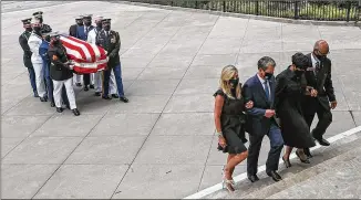  ?? ALYSSA POINTER / ALYSSA.POINTER@AJC.COM ?? First lady Mary Kemp (from left), Gov. Brian Kemp, Atlanta Mayor Keisha Lance Bottoms and state Rep. Calvin Smyre lead the body of Rep. John Lewis into the State Capitol on Wednesday. Lewis’ body and family members returned to Georgia for the Capitol ceremonies.