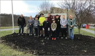  ?? SUBMITTED PHOTOS ?? Members of Shoemakers­ville Scout Troop 163prepped the flower beds for Perry Township Recreation Area as a community service project on April 4.