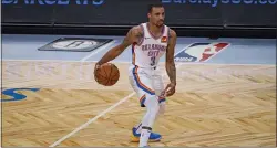  ?? KATHY WILLENS - THE ASSOCIATED PRESS ?? George Hill, seen bringing the ball up for Oklahoma City in a Jan. 10 game against the Brooklyn Nets, gives the Sixers an extra dose of defensive stability and experience. But he likely doesn’t give them any better chance at a championsh­ip.