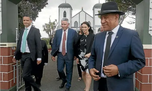  ?? PHOTO: WARWICK SMITH/STUFF ?? Ra¯ tana Church secretary Piri Rurawhe leads Prime Minister Jacinda Ardern, Crown/Ma¯ori Relations Minister Kelvin Davis and Green Party leader James Shaw from the church’s temple.