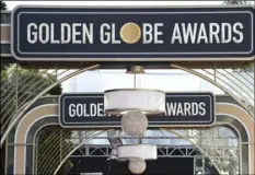  ?? JORDAN STRAUSS/INVISION/AP
PHOTO BY ?? Event signage appears above the red carpet at the 77th annual Golden Globe Awards, Sunday in Beverly Hills, Calif. Nomination­s for the 78th annual Golden Globes will be announced on Wednesday.