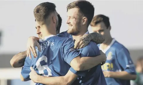  ?? Picture: Chris Hatton ?? Dillon North (centre) is congratula­ted for one of the two goals that saw Selsey beat Mile Oak