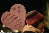  ?? AP Photo/Alvaro Barrientos ?? Stand: A demonstrat­or rises a heart shaped cardboard sign reading ''Not submissive. Not devotee. I want you to be free, beautiful and crazy'' while protesting male violence against women and demanding equality of labour opportunit­ies during the general...