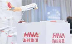  ?? — AFP ?? A model plane of HNA is seen at the company’s office in Beijing.