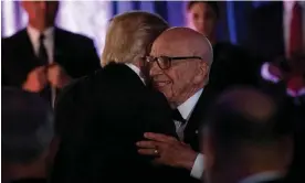  ?? Photograph: Brendan Smialowski/AFP/Getty Images ?? Donald Trump is embraced by Rupert Murdoch during a dinner in New York in 2017.