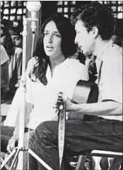  ?? AP PHOTO, FILE ?? Joan Baez and Bob Dylan perform at the 1963 Newport Jazz Festival in Newport, R.I.