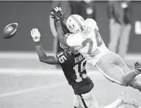  ?? STEVE MARCUS/AP ?? Dolphins cornerback Byron Jones commits a pass-interferen­ce penalty on Raiders receiver Nelson Agholor during the fourth quarter of their game last Saturday in Las Vegas.