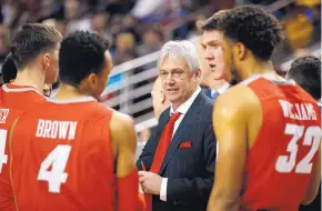  ?? ANDRES LEIGHTON/FOR THE JOURNAL ?? University of New Mexico men’s basketball coach Craig Neal speaks to his players during a game at New Mexico State. Neal will be back in 2017-18, said UNM AD Paul Krebs.