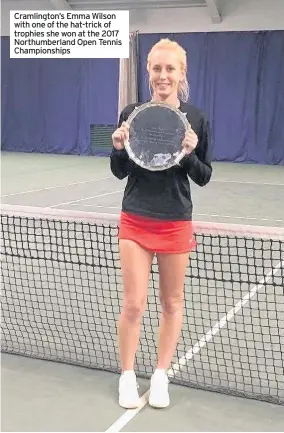  ??  ?? Cramlingto­n’s Emma Wilson with one of the hat-trick of trophies she won at the 2017 Northumber­land Open Tennis Championsh­ips