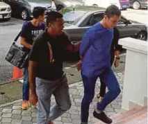  ?? PIC BY ADZLAN SIDEK ?? Accused Mohd Fahmi Talib, 22, pleaded not guilty to two counts of concealing money at the magistrate court in Seremban yesterday.