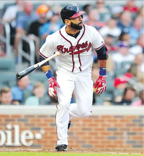  ?? SCOTT CUNNINGHAM/GETTY IMAGES ?? Jose Bautista hits a double in his first at-bat with the Atlanta Braves in a loss to San Francisco Friday in Atlanta.