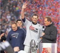  ?? WINSLOW TOWNSON / USA TODAY SPORTS ?? New England Patriots quarterbac­k Tom Brady celebrates with the Lamar Hunt Trophy after the game.