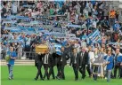  ?? ?? Tributes…Marseille supporters flocked to the Stade Velodrome for Tapie’s funeral
