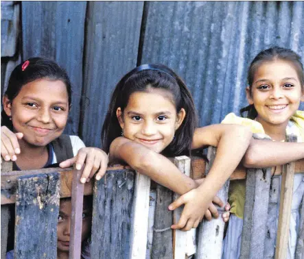  ?? PHOTOS: RICK STEVES ?? Taking an educationa­l tour often means you’ll visit a struggling part of the world and engage with the locals, such as these schoolchil­dren in El Salvador.