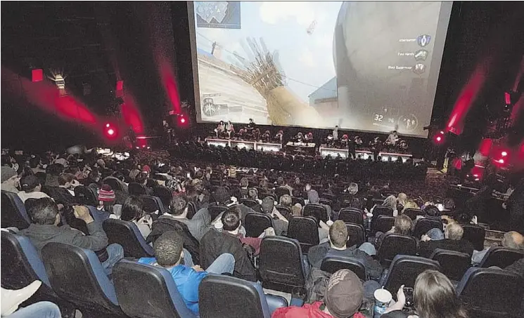  ?? THE CANADIAN PRESS/HANDOUT ?? People watch the Call of Duty Championsh­ip on March 2016 during the Cineplex World Gaming Call of Duty: Infinite Warfare tournament. Cineplex’s diversifie­d strategy into other entertainm­ent such as gaming tournament­s is seen as a double-edged sword for the company as it suffers dampened results in the second quarter.