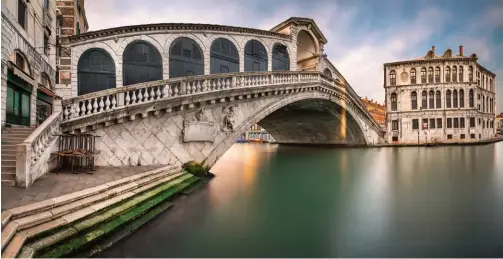  ??  ?? The Rialto Bridge is the oldest of the four bridges spanning the Grand Canal in Venice. Connecting the sestieri (districts) of San Marco and San Polo, it has been rebuilt several times since its first constructi­on as a pontoon bridge in the 12th century.