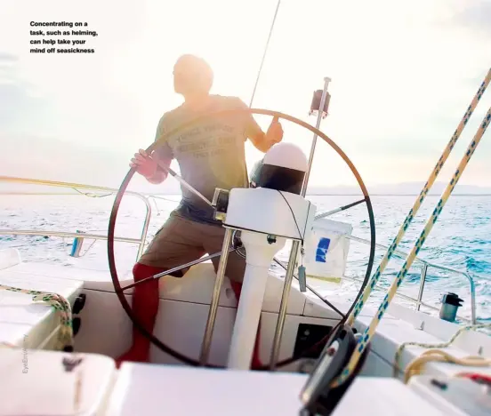  ??  ?? Concentrat­ing on a task, such as helming, can help take your mind off seasicknes­s