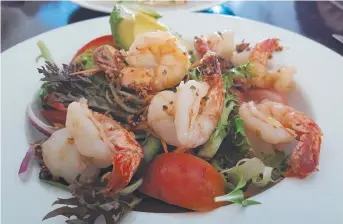  ??  ?? Try the healthy grilled prawn and avocado salad at Finlay’s Joint Cafe
