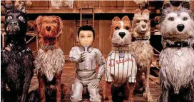  ?? [PHOTO PROVIDED BY FOX SEARCHLIGH­T PICTURES] ?? In “Isle of Dogs,” a 12-year-old boy (voice of Koyu Rankin, center) goes looking for his missing dog and encounters a pack of exiled dogs (from left, Bryan Cranston as Chief, Bob Balaban as King, Bill Murray as Boss, Edward Norton as Rex and Jeff...