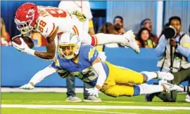  ?? Robert Gauthier Los Angeles Times ?? CHIEFS TIGHT END Jody Fortson dives past Chargers cornerback Bryce Callahan after completing a 40-yard pass play in the second quarter.