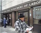  ?? JOHN MINCHILLO/AP ?? Visitors to the Department of Labor are turned away because of closures over coronaviru­s concerns in New York City.