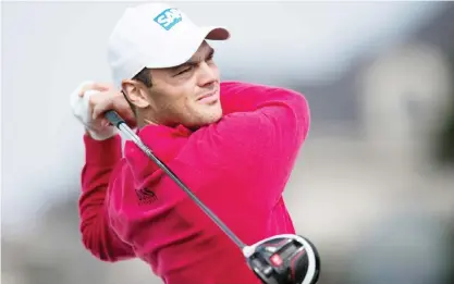  ??  ?? SHANGHAI: Martin Kaymer of Germany tees off during the pro am event ahead of the BMW Shanghai Masters golf tournament at the Lake Malaren Golf Club in Shanghai yesterday. — AFP