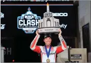  ?? AP PHOTO/MARK J. TERRILL ?? Denny Hamlin poses with his troph after winning the Busch Light Clash NASCAR exhibition auto race at Los Angeles Memorial Coliseum Saturday, Feb. 3, 2024, in Los Angeles.