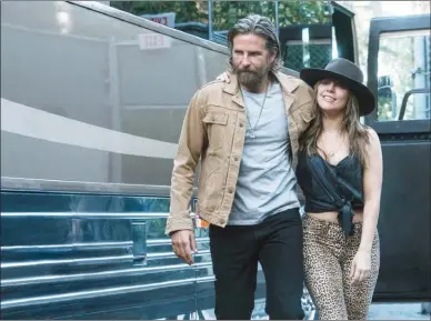  ?? The Associated Press ?? Bradley Cooper and Lady Gaga are pictured in a scene from “A Star Is Born,” which opened in wide release this week and is being considered an early Oscar contender.