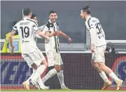  ?? AFP ?? Juventus midfielder Hamza Rafia, centre, is congratula­ted by his teammates.