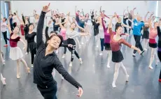  ?? PHOTOS BY GAO ERQIANG / CHINA DAILY ?? From left: Wu Husheng, a principal dancer with Shanghai Ballet, leads a public class; Shanghai Ballet holds free classes for members of the public every two months.