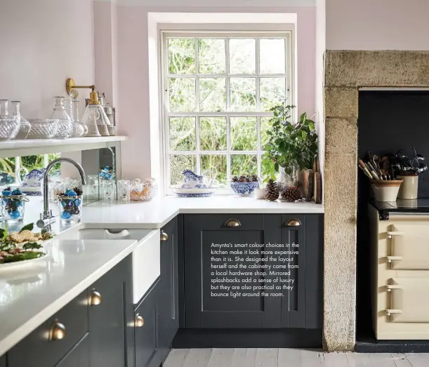  ??  ?? Amynta’s smart colour choices in the kitchen make it look more expensive than it is. She designed the layout herself and the cabinetry came from a local hardware shop. Mirrored splashback­s add a sense of luxury but they are also practical as they bounce light around the room.