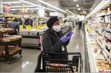  ?? LAURA MCDERMOTT — THE NEW YORK TIMES ?? Instacart said this week it will give workers masks, hand sanitizer and thermomete­rs in response to worker demands.