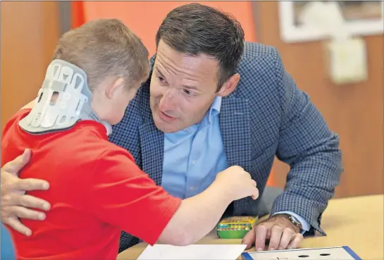  ?? [MADDIE SCHROEDER/FOR THE DISPATCH] ?? Conner Cummins, 11, hugs Circlevill­e Schools Superinten­dent Jonathan Davis after receiving his help on a lesson during the Summer Learning Academy at Circlevill­e Elementary School on Tuesday.