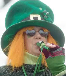  ?? MICHAEL KUBEL/THE MORNING CALL ?? A member of the O’Faidley Celtic Kazoo Band plays in the Allentown St. Patrick’s Day Parade.