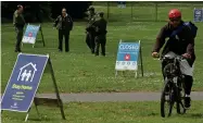  ??  ?? ASSOCIATED PRESS
San Francisco Park Rangers guard an entrance that leads to Hippie Hill due to COVID-19 concerns on Monday, April 20, 2020, at Golden Gate Park in San Francisco. People annually gather on April 20, 4/20, to smoke marijuana on Hippie Hill.