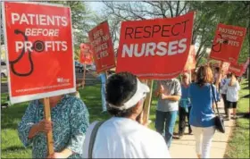  ?? EVAN BRANDT — DIGITAL FIRST MEDIA ?? Picketers in front Pottstown Hospital chanted “1, 2, 3, 4, safe staffing on the floor, 5, 6, 7, 8, Tower must negotiate.”