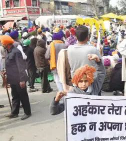  ??  ?? AT SINGHU on February 4. The placard proclaims that farmers will vanquish the government’s arrogance and will not compromise on their rights.