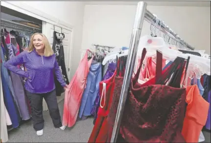  ??  ?? Richardson speaks about the hundreds of prom dresses in her home.