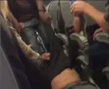  ?? @JAYSEDAVID, TWITTER ?? A still from a social media video shows a passenger being dragged off an overbooked United flight.