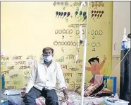  ?? REUTERS ?? A man suffering from Covid-19 receives oxygen support inside a Covid-19 care facility on the outskirts of Mumbai on May 24.