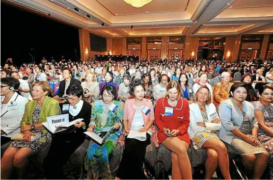  ??  ?? Women to the fore: Participan­ts at the Global Summit of Women 2013 in Kuala Lumpur. In its 23rd year, the recent summit attracted the largest group of attendees from across some 70 countries.