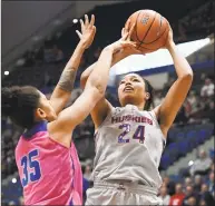  ?? Jessica Hill / Associated Press ?? UConn’s Napheesa Collier, right, shoots as Memphis’ Jasmine James defends during Wednesday’s game.